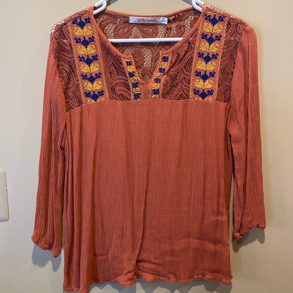 Orange top from a small boutique in Colorado
